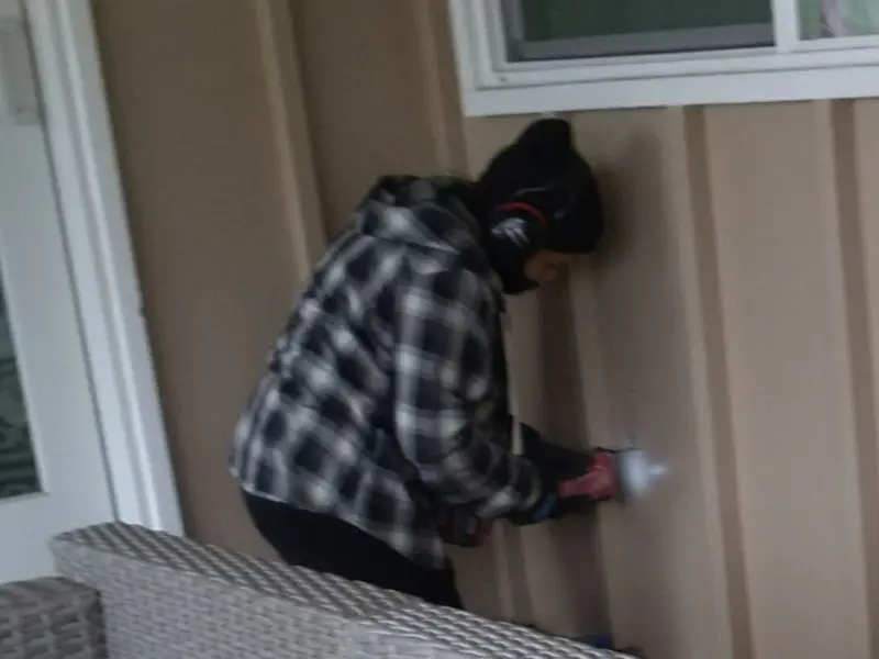 Professional electrician installing an exterior outlet in Ligonier