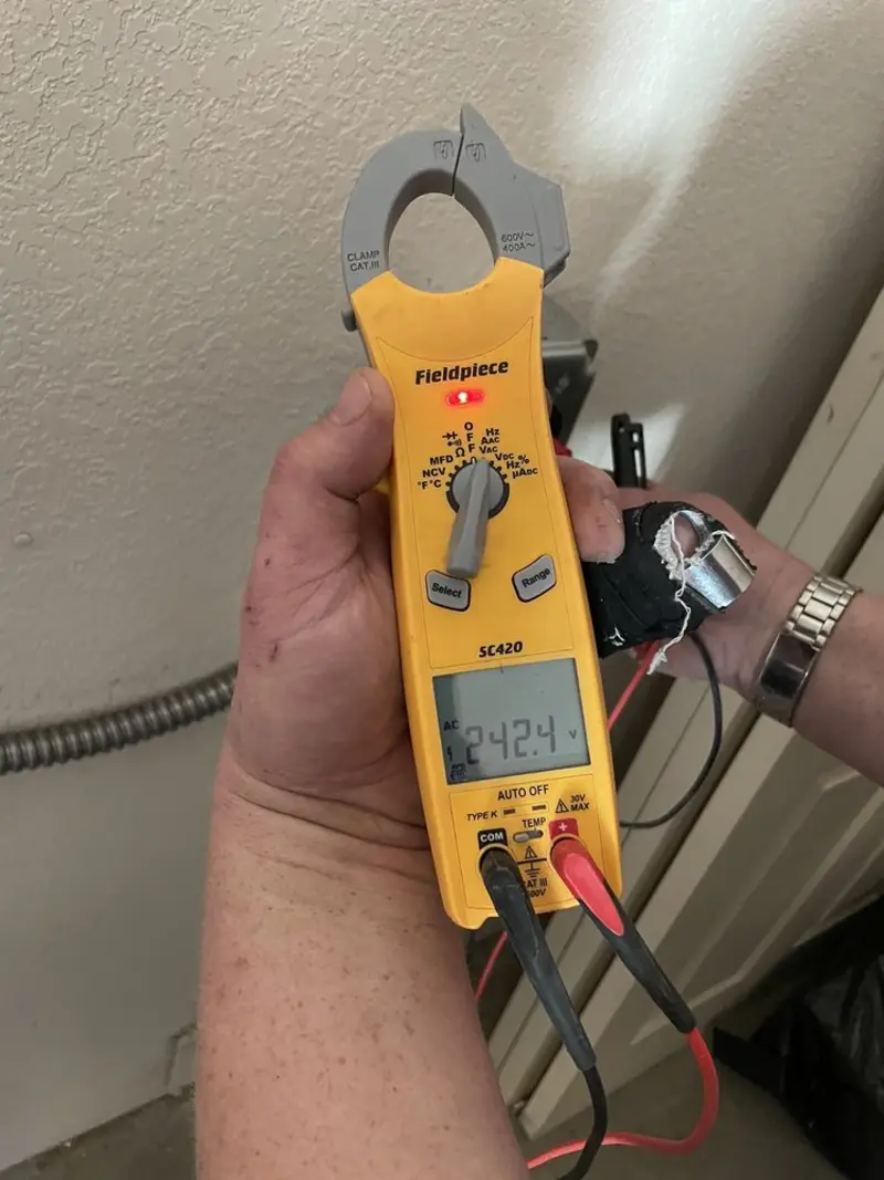 Voltage testing with clamp meter during Outlet Installation in Ligonier